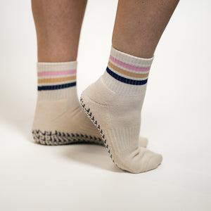 Confetti grip socks by PikeFit: white crew sock with blue, beige and pink stripes